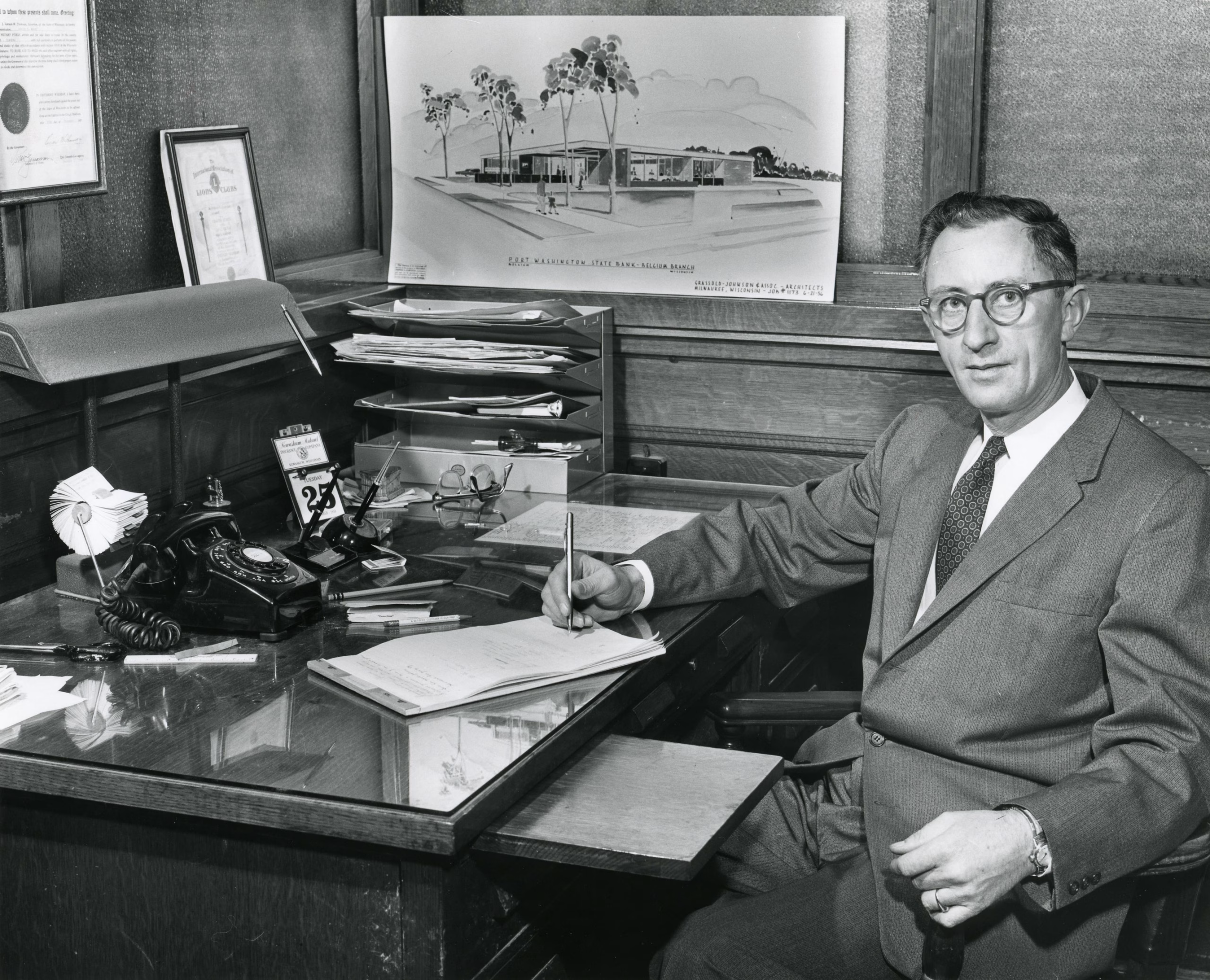 Adolph Ansay at his desk at Port Washington State Bank in Belgium, Wisconsin About Adolph Ansay
